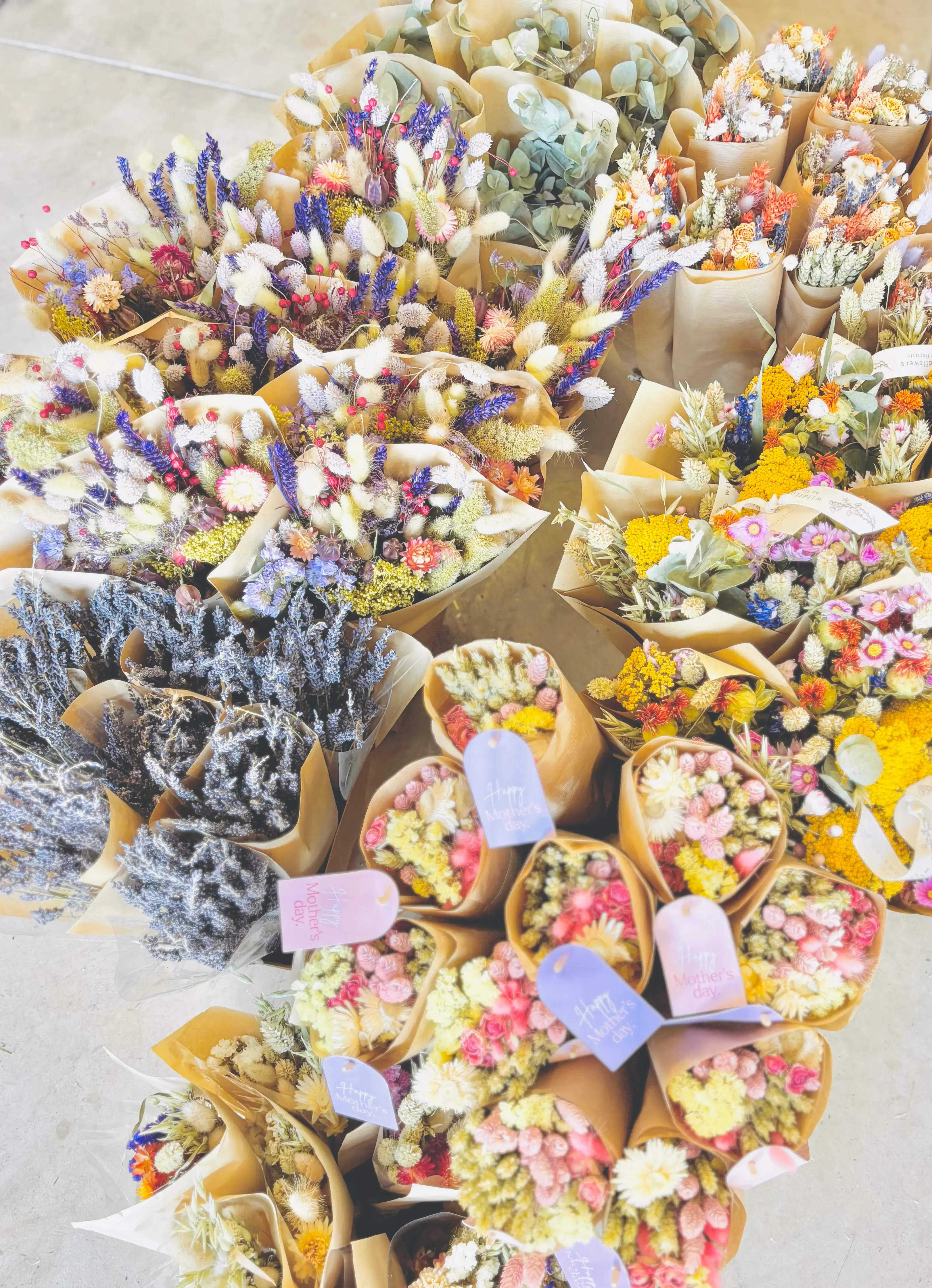 Customer photo of colorful dried flower bouquets displayed for retail